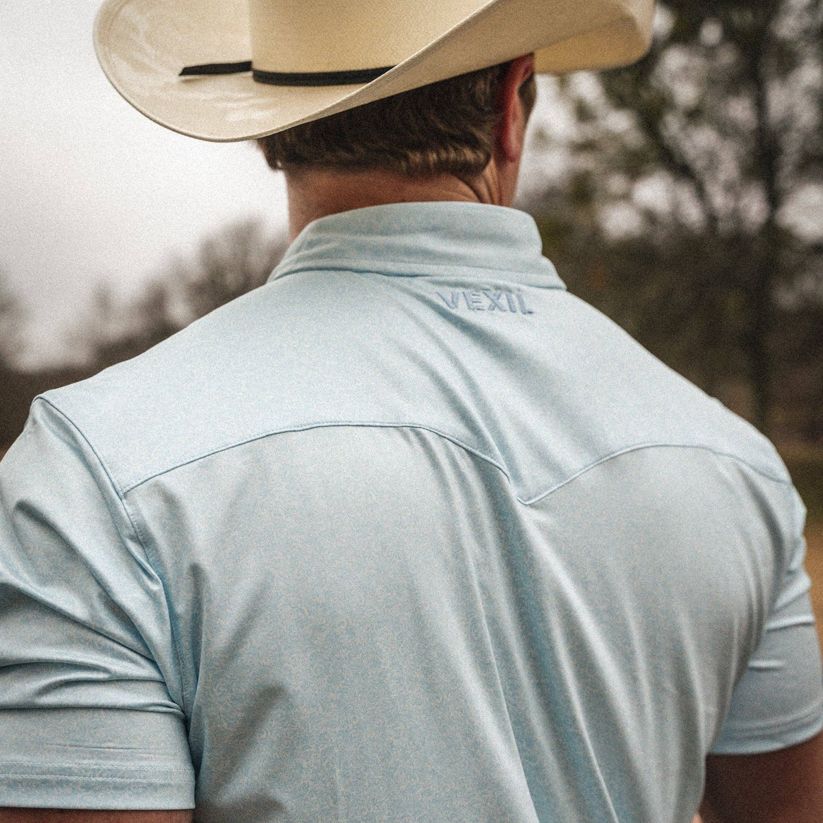 Western Pearl Snap Polo | Light Blue